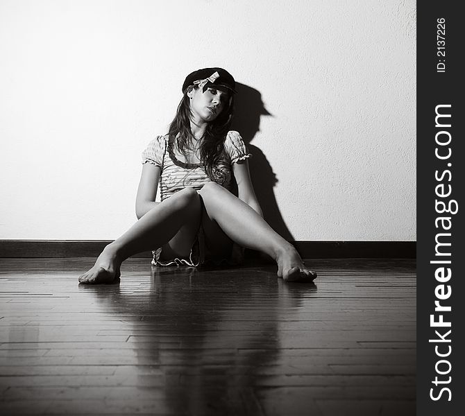 Loneliness: woman sitting on the floor crying
