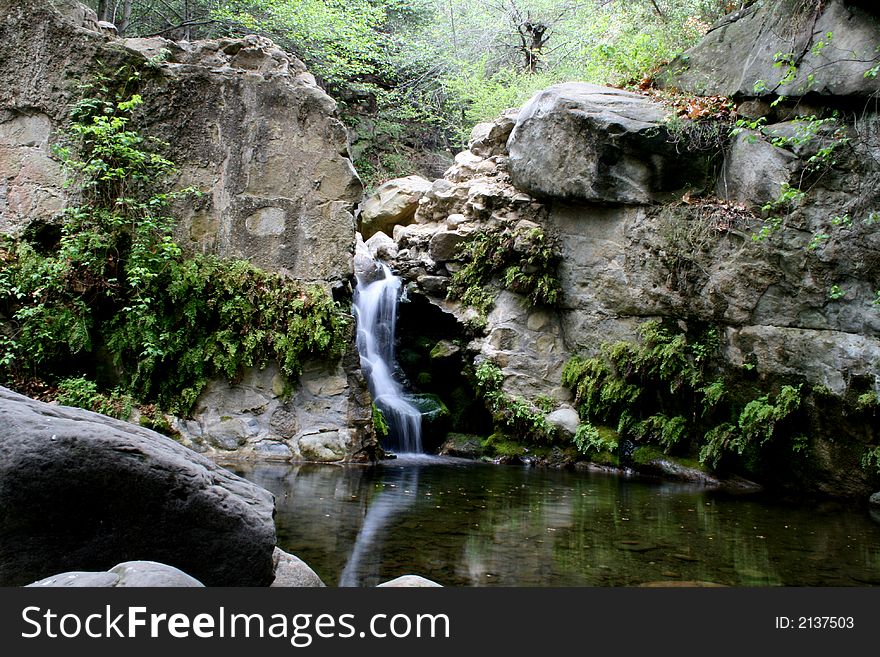 The waterfall in a small pool in Rattlesnake Canyon
