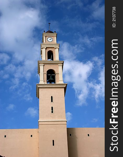 The clock tower of St. Peter's church in Jaffa, Israel against gorgeous blue sky. The clock tower of St. Peter's church in Jaffa, Israel against gorgeous blue sky