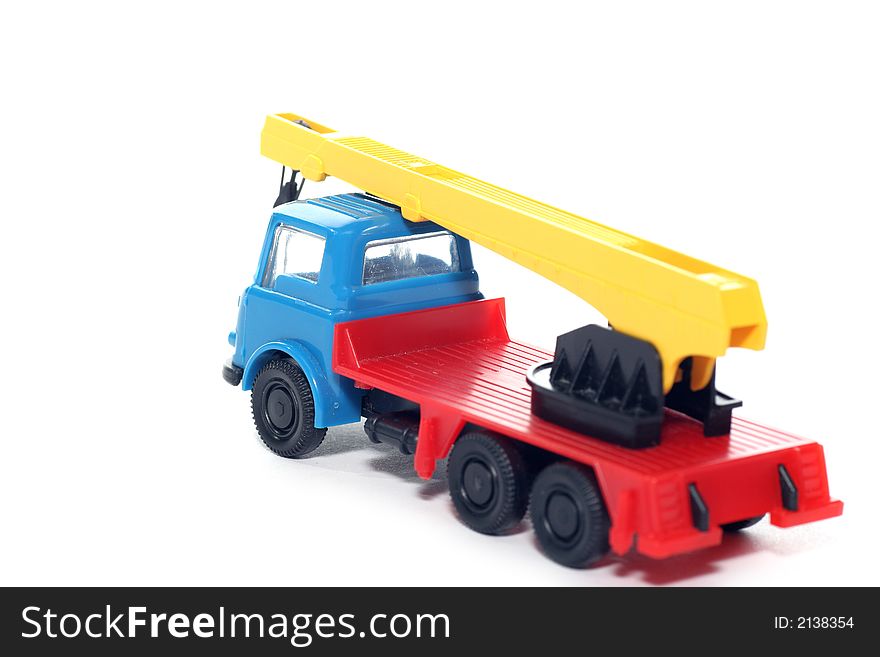 Picture of a old small Bedford crane truck. Greek plastic toy from my brothers toy collection. Isolated on real white. Picture of a old small Bedford crane truck. Greek plastic toy from my brothers toy collection. Isolated on real white