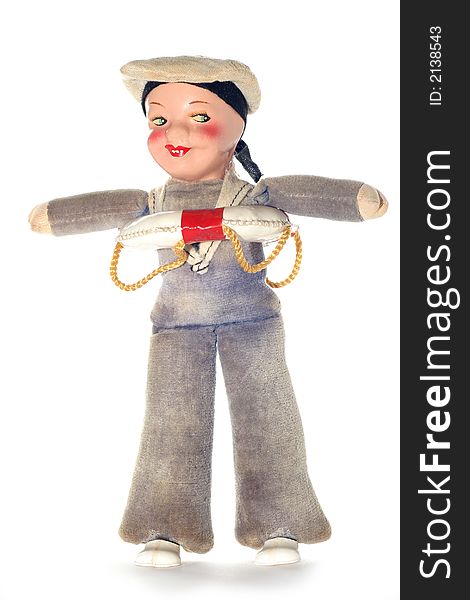 Picture of a old sailor doll. Dates around the 2nd world war or later. Is it male or female? Hard to say.Isolated on real white. Picture of a old sailor doll. Dates around the 2nd world war or later. Is it male or female? Hard to say.Isolated on real white