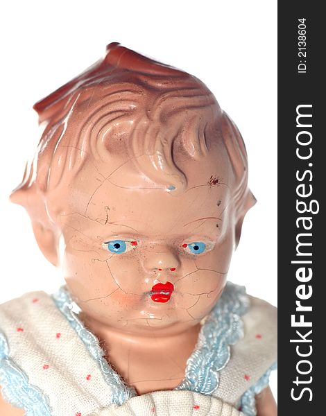 Picture of a old abused porcelain girl (or is it a boy???)doll. Dates around 1950 or later .Isolated on real white. Picture of a old abused porcelain girl (or is it a boy???)doll. Dates around 1950 or later .Isolated on real white