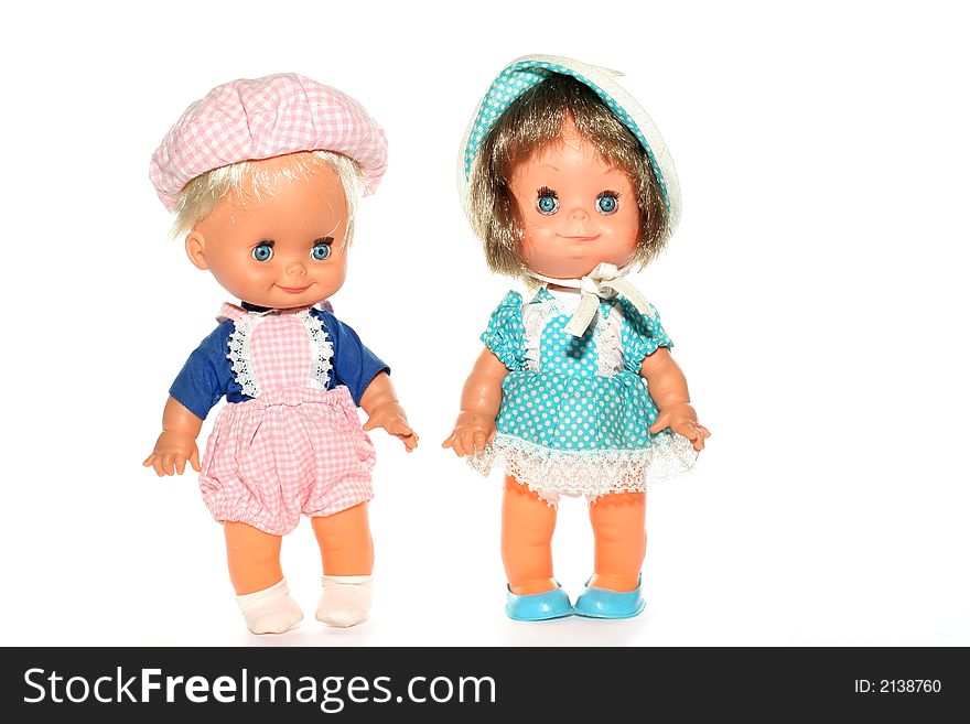 Picture of two typical 70´s dolls (made in Greece). Isolated on white (real white). Picture of two typical 70´s dolls (made in Greece). Isolated on white (real white)