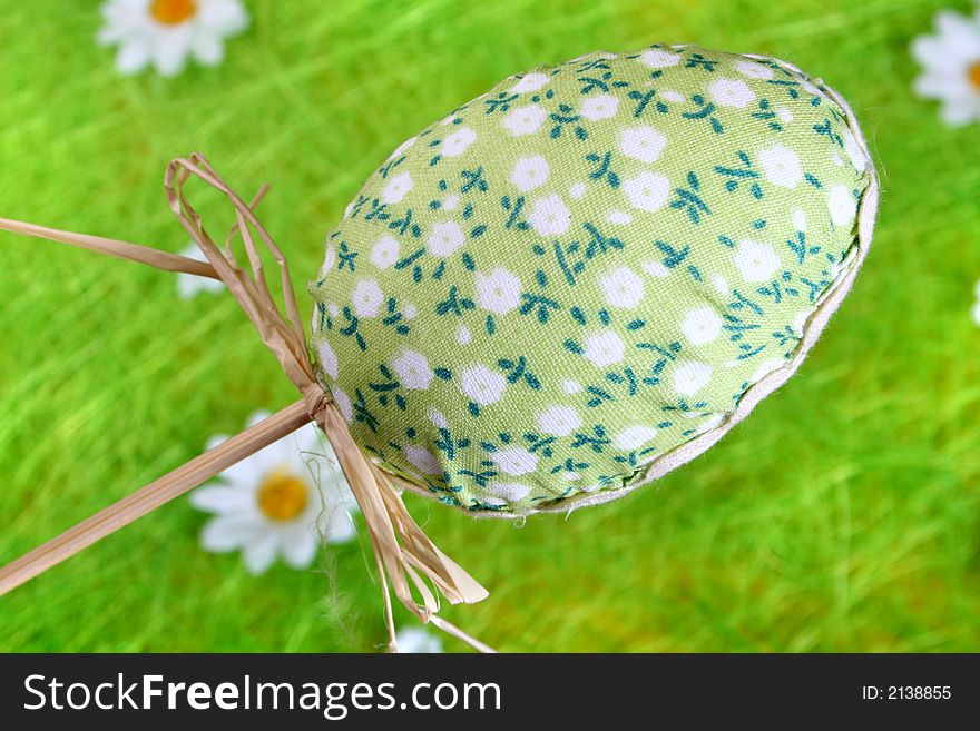 Easter egg painted over green grass. Easter egg painted over green grass.