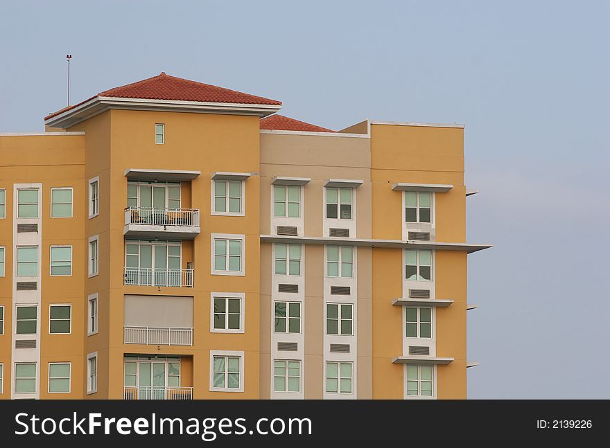 New colorful condominium building on tropical island. New colorful condominium building on tropical island