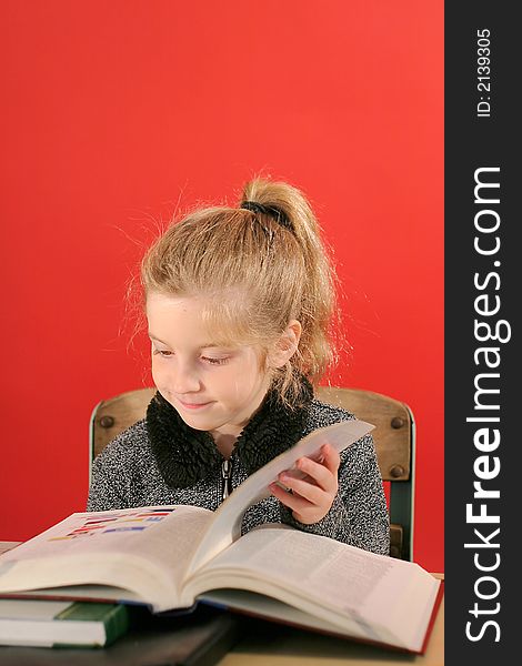 Shot of a little girl studying