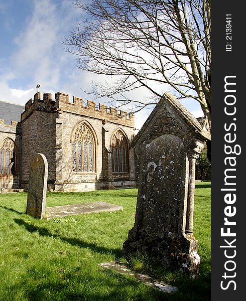 Medieval English Village Church and ancient Gravestones. Medieval English Village Church and ancient Gravestones
