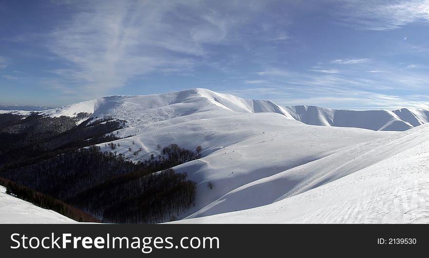 Panoramic picture of mountains covered with snow. Panoramic picture of mountains covered with snow
