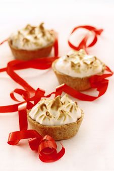 Mini Meringue Apple Pies On White With Red Ribbon Stock Image Mini Meringue Apple Pies On White With Red Ribbon Stock Image