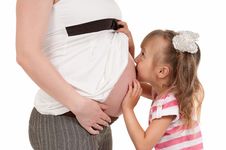 Pregnant Woman With Her Daughter Stock Photos