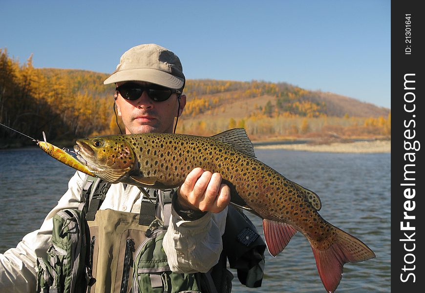 Fishing - fisherman catched big trout