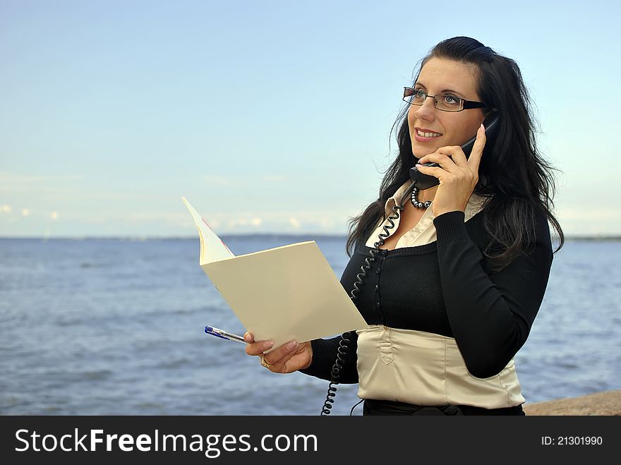 Girl with a telephone receiver in hand, space for text