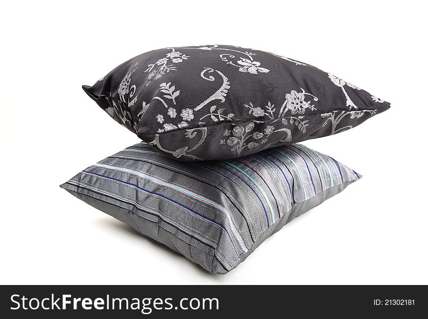 Gray and black pillows isolated on white