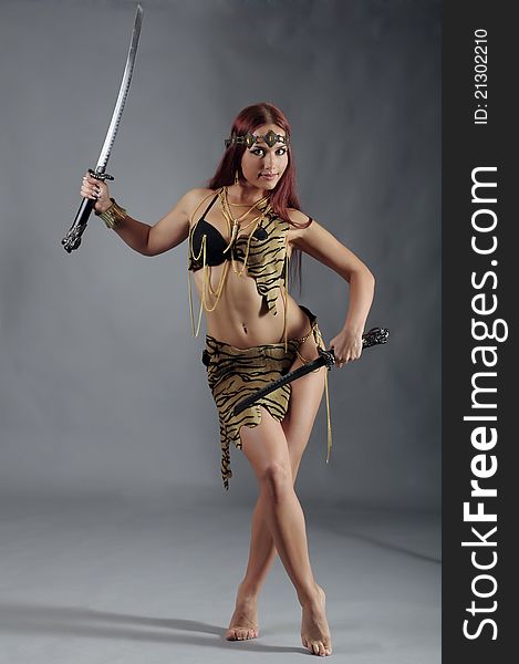 Warrior woman holding sword in her hand