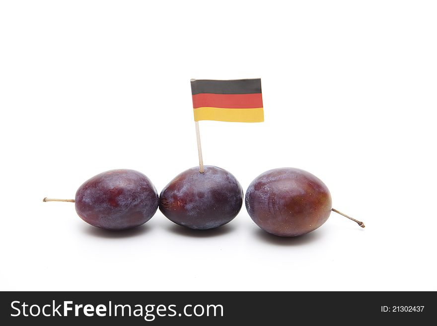 Plums with Germany flag on white background