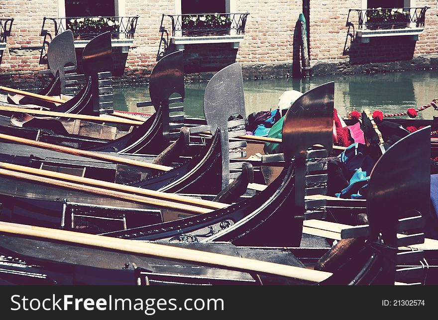 A lot of gondola in a canal of Venice