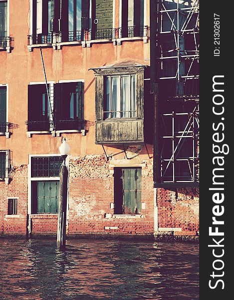 Antique balcony and historic building in Venice