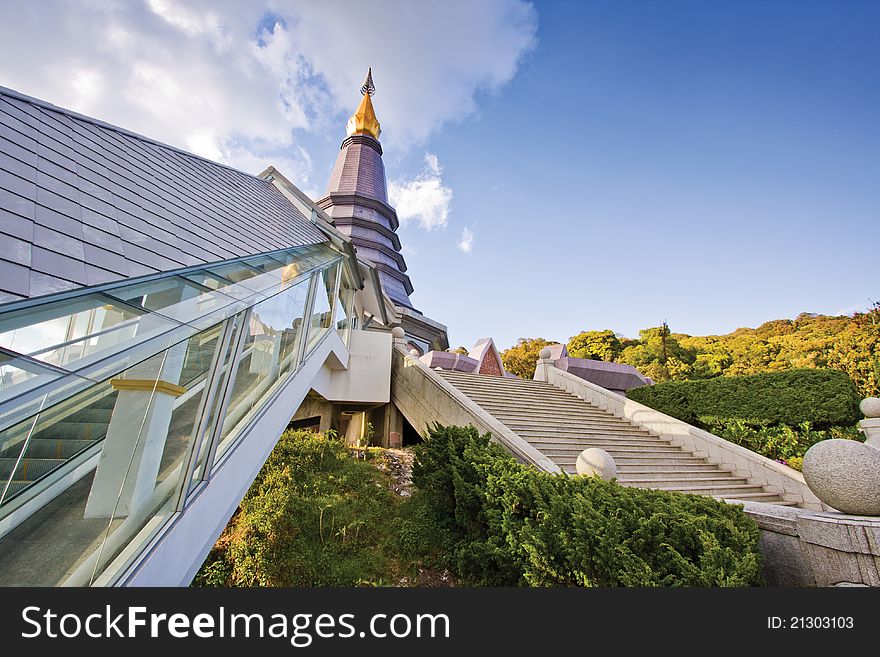 This place is pagoda which located at Doi Inthanon, Chiangmai, Thailand. Escalator that located at the left side of picture was build for old people. This place is pagoda which located at Doi Inthanon, Chiangmai, Thailand. Escalator that located at the left side of picture was build for old people.