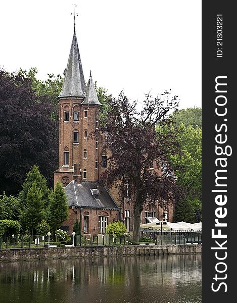 Historic building near a small lake in Bruges. Historic building near a small lake in Bruges