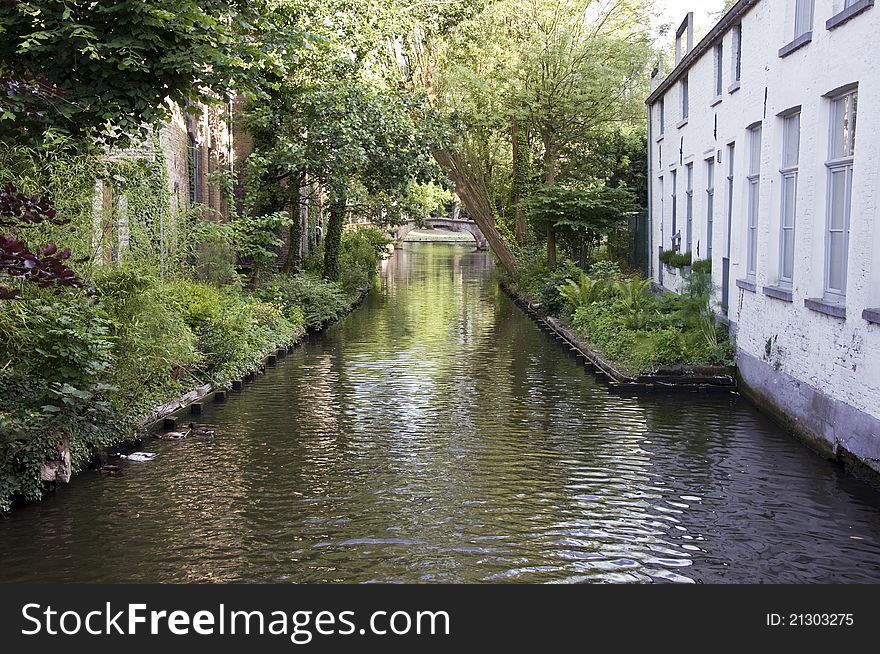 Small canal in the historic town of Bruges, Belgium. Small canal in the historic town of Bruges, Belgium