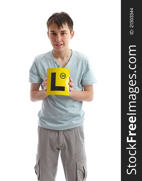 Teenage boy holding L plates (or other sign). White background. Teenage boy holding L plates (or other sign). White background.