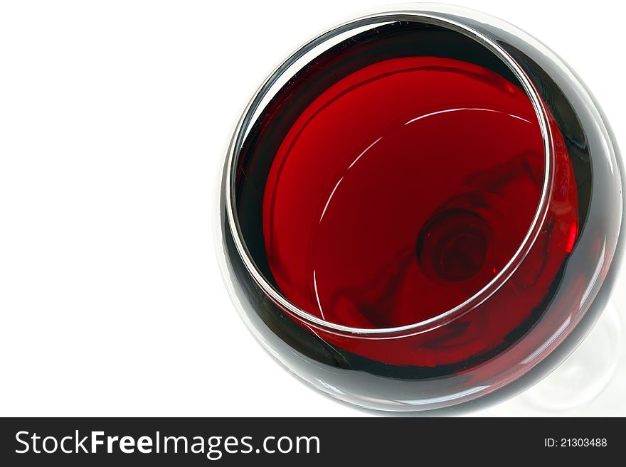 Glass of red wine over white with space for text