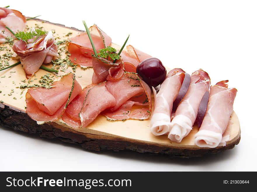 Ham on wooden board with herbs and cherry. Ham on wooden board with herbs and cherry