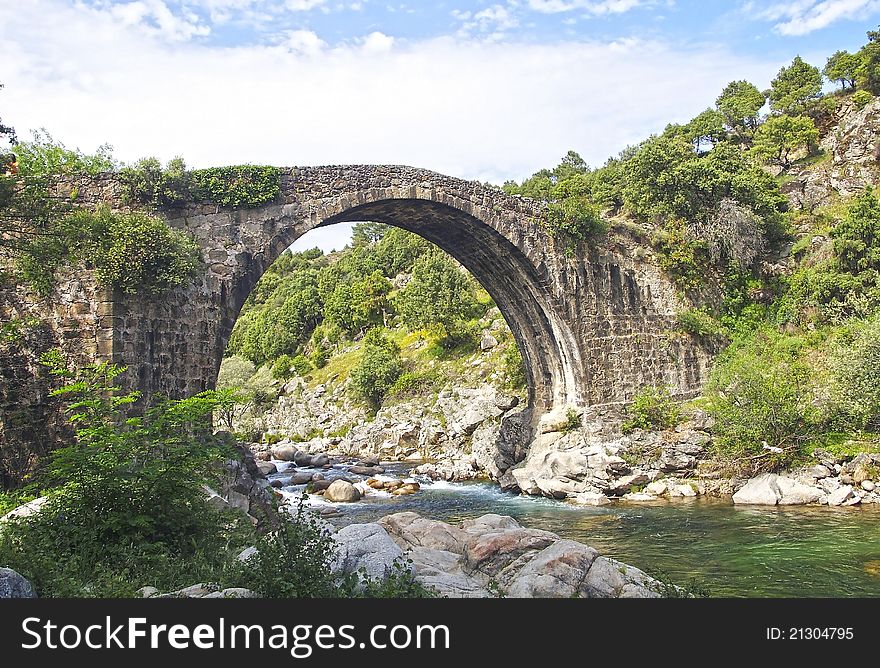 Roman bridge in the side, province of Caceres, Spain