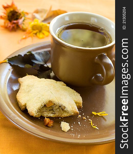 Vegetable or meat pie with cup of tea. Selective focus. Vegetable or meat pie with cup of tea. Selective focus