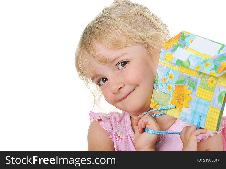 Little Cute Girl With Present Posing To Camera