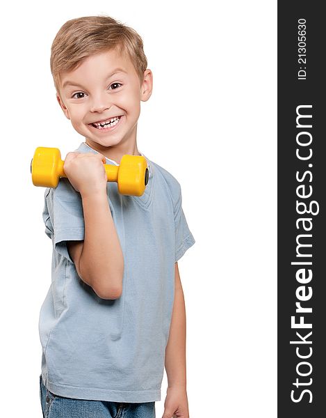 Portrait of a healthy little boy working out with dumbbells over white background. Portrait of a healthy little boy working out with dumbbells over white background