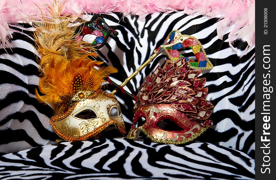 Image shoeing brightly coloured masquerade masks on retro style chair. Image shoeing brightly coloured masquerade masks on retro style chair