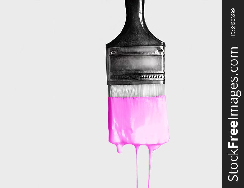 Brush with pink paint dripping. Brush with pink paint dripping