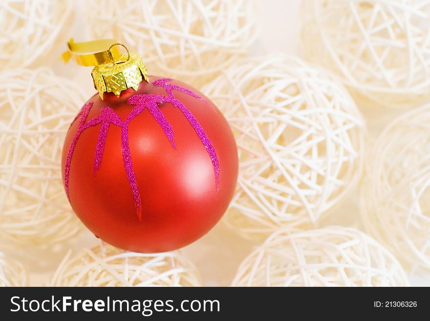 Traditional christmas and new year decoration ball on the background made of straw balls. Traditional christmas and new year decoration ball on the background made of straw balls