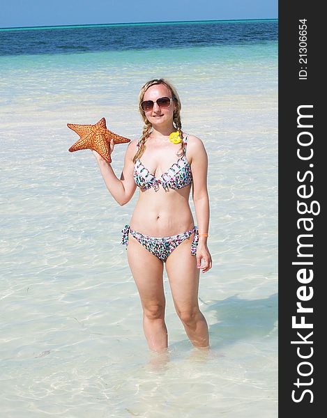 A Young Woman With A Starfish