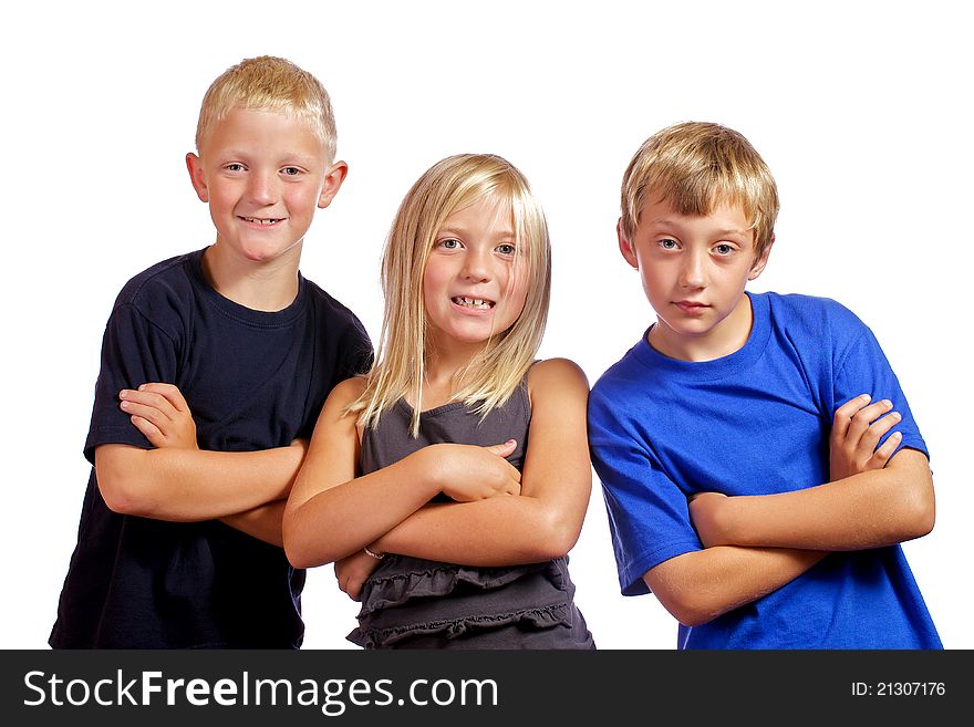 Three friends with arms crossed posing for the camera. Three friends with arms crossed posing for the camera