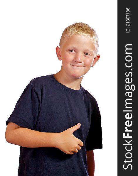 Boy smiling and posing for the camera giving a thumbs up sign. Boy smiling and posing for the camera giving a thumbs up sign.