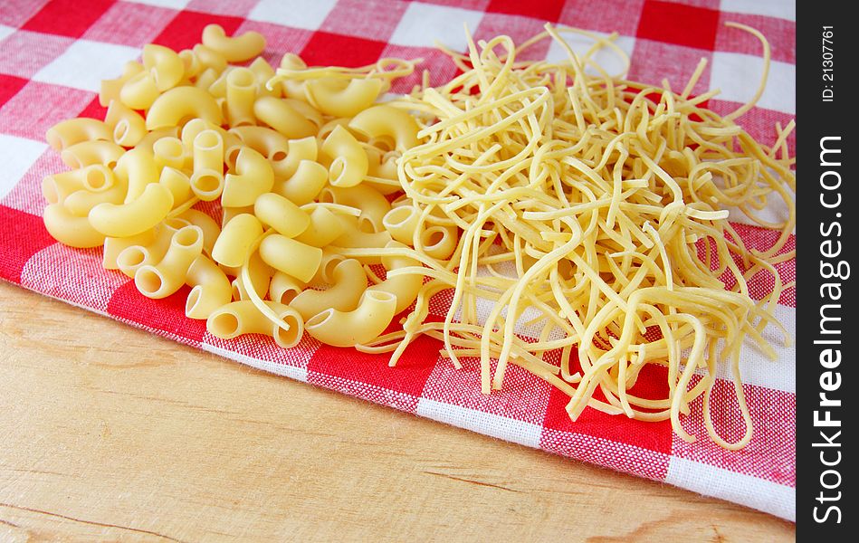 Raw italian pasta on red white towel. Raw italian pasta on red white towel