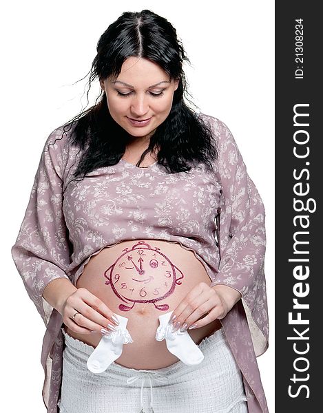 Tummy of pregnant woman with funny drawing over white background. Tummy of pregnant woman with funny drawing over white background