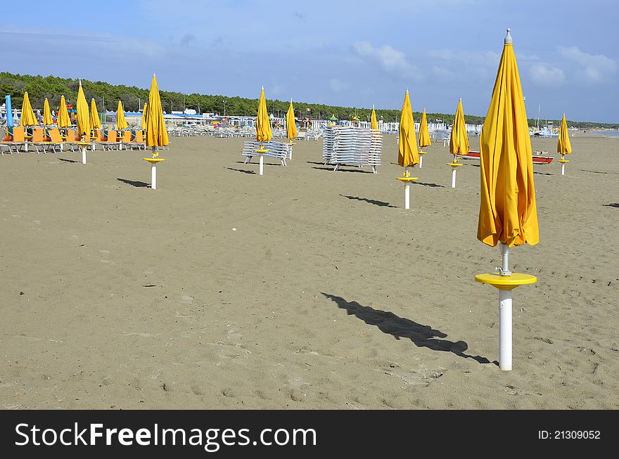 Yellow umbrellas on the beach in Italy. Yellow umbrellas on the beach in Italy