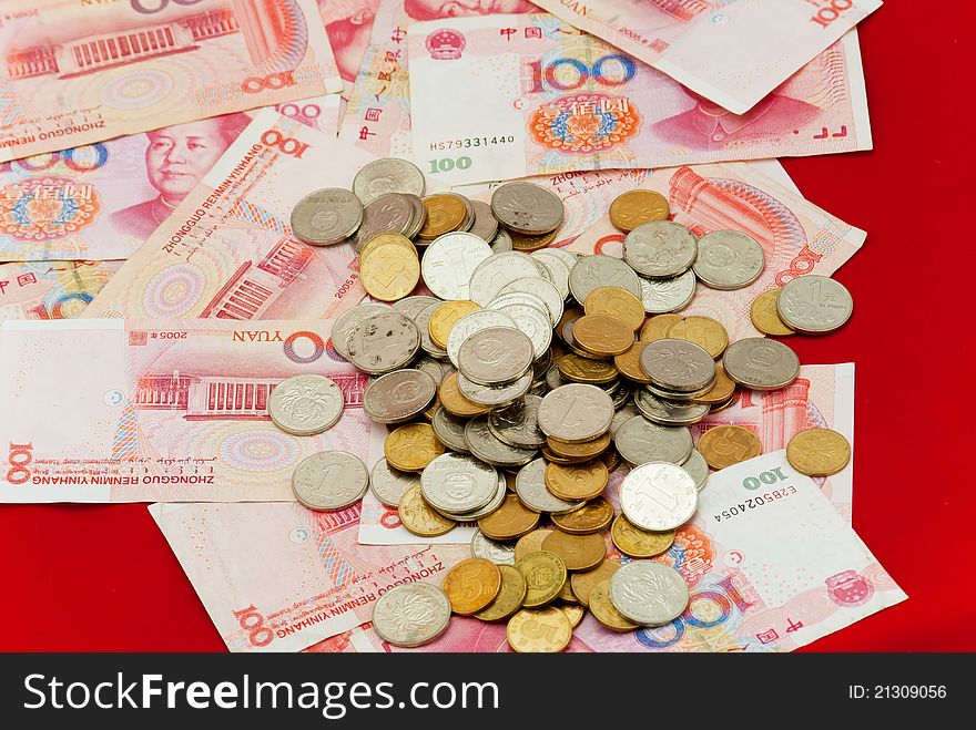 China's yuan, and a pile of coins, for financial material. China's yuan, and a pile of coins, for financial material
