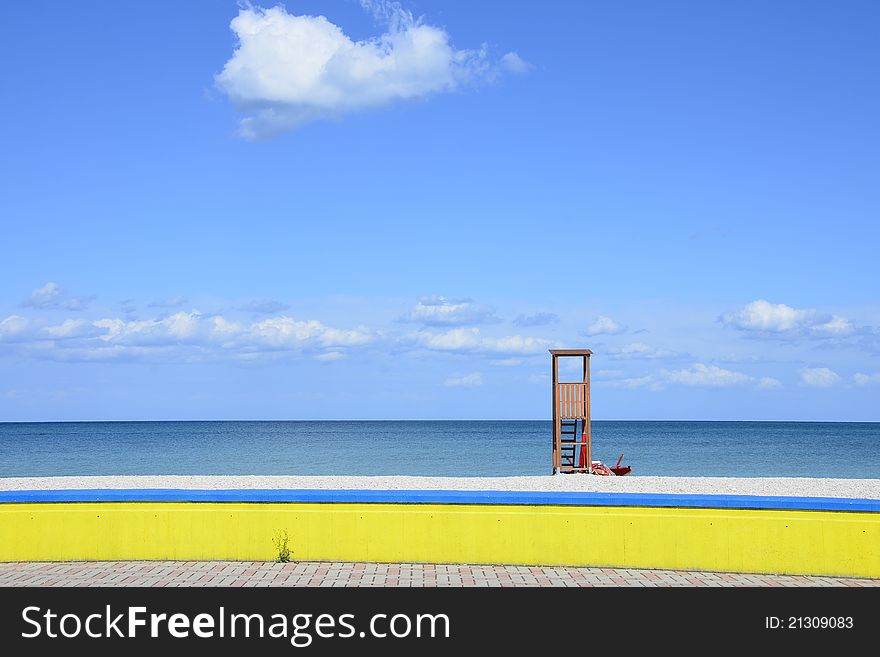 Italian sea side with watching place and yellow fence. Italian sea side with watching place and yellow fence