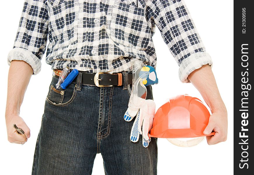 A worker with helmet in hand, and tools. A worker with helmet in hand, and tools.