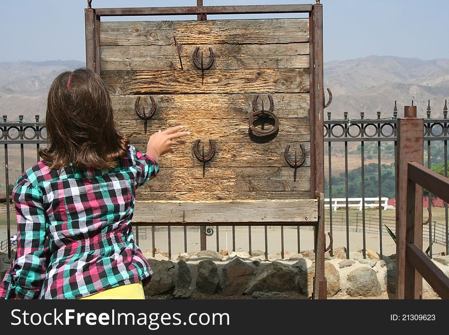 Girl Playing Horseshoes