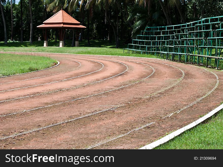 Background of an old racetrack and green grass.