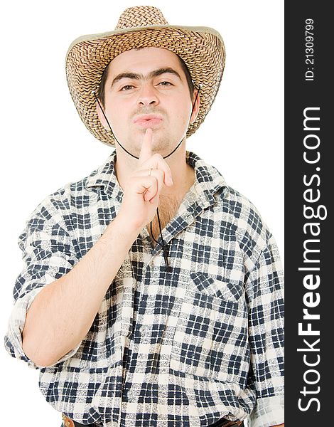 Cowboy blows on his finger on a white background. Cowboy blows on his finger on a white background.