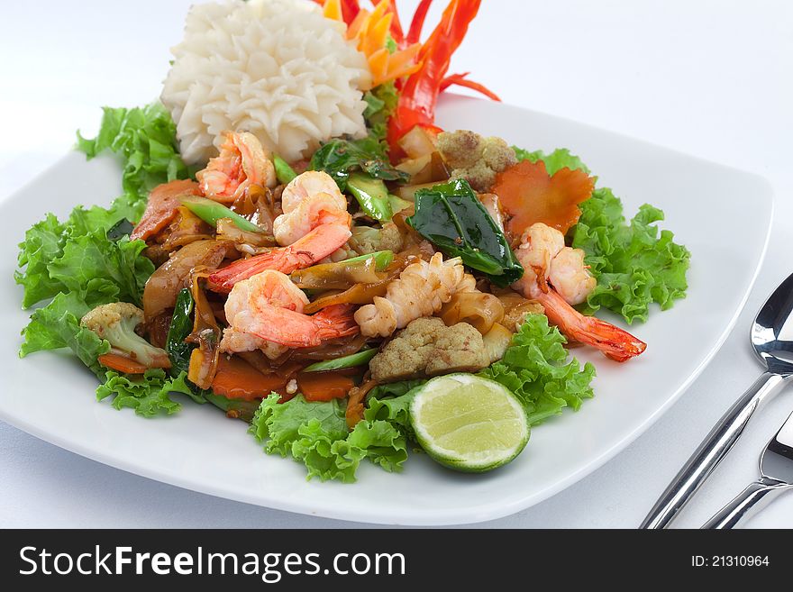 Close up view of nice shrimps with vegetables on white back. Close up view of nice shrimps with vegetables on white back