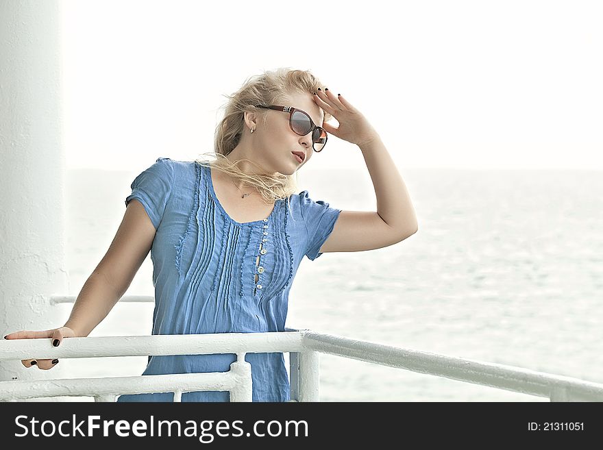 Portrait of nice young woman having good time on sea view back. Portrait of nice young woman having good time on sea view back