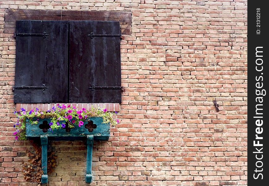 An Ancient Rural Wood Window with Flowers. An Ancient Rural Wood Window with Flowers