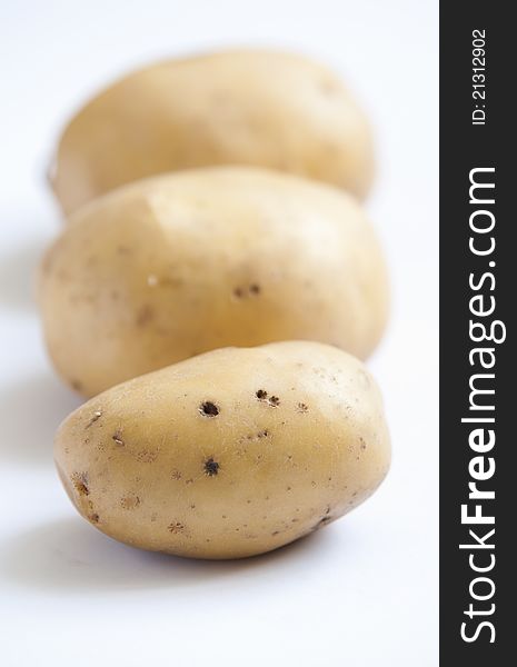 Bunch Of Potatoes On White Background